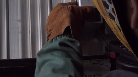 Close up of worker welding