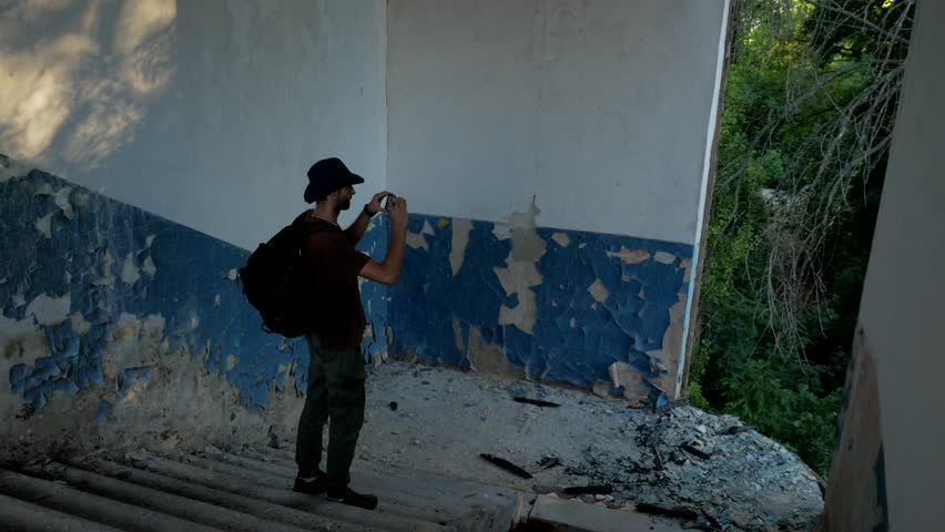 Tourist Explores Stairs Ruins Old Building Stock Footage Video 100   1 