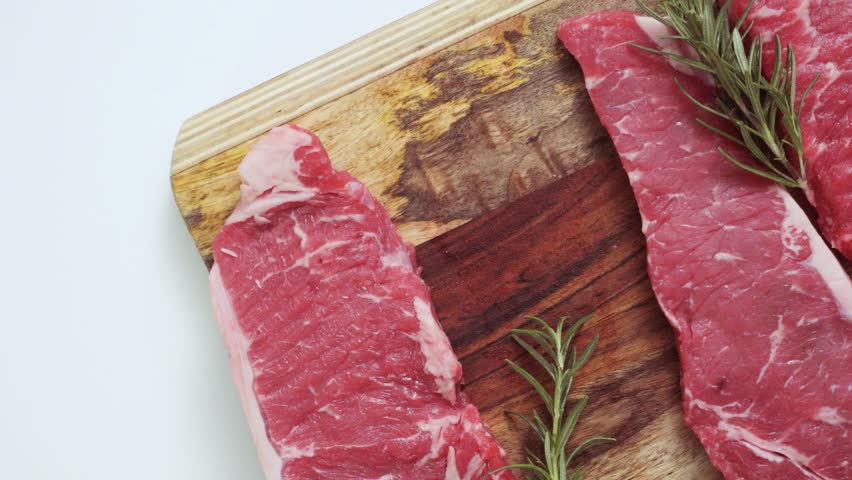 Raw New York Strip Steaks Stock Footage Video (100% Royalty-free