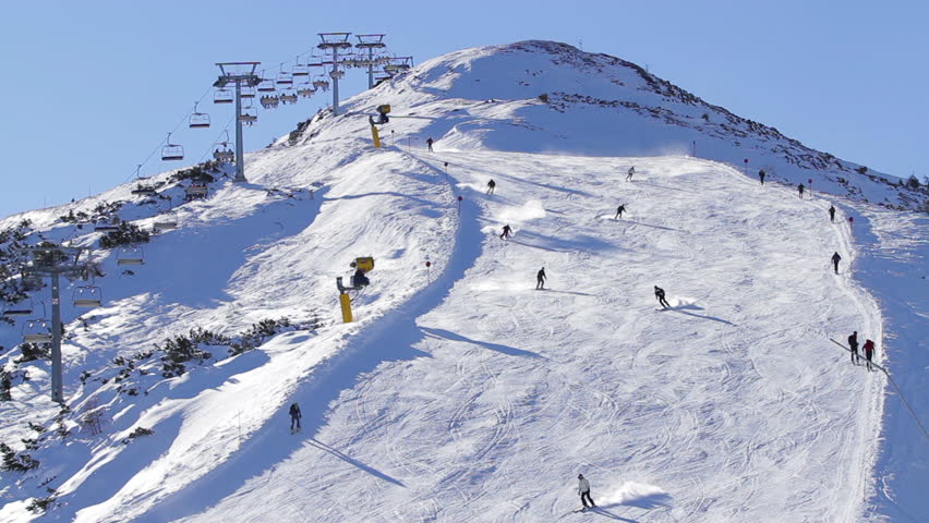 People skiing on ski slopes Italy morning time | Shutterstock HD Video #1013763356