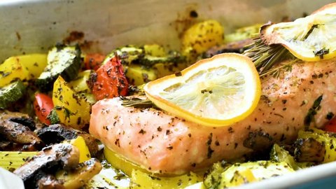 Baked salmon with vegetables and lemon