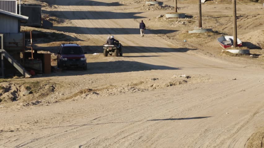 Riding an ATV in the Streets of Pond Inlet, Nunavut