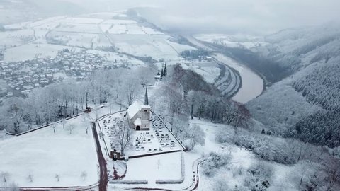 Aerial view of the Funerary Chapel for John of Luxembourg and old church St. Johannes in winter, Kastel-Staadt, Saar Valley, Rhineland-Palatinate, Germany