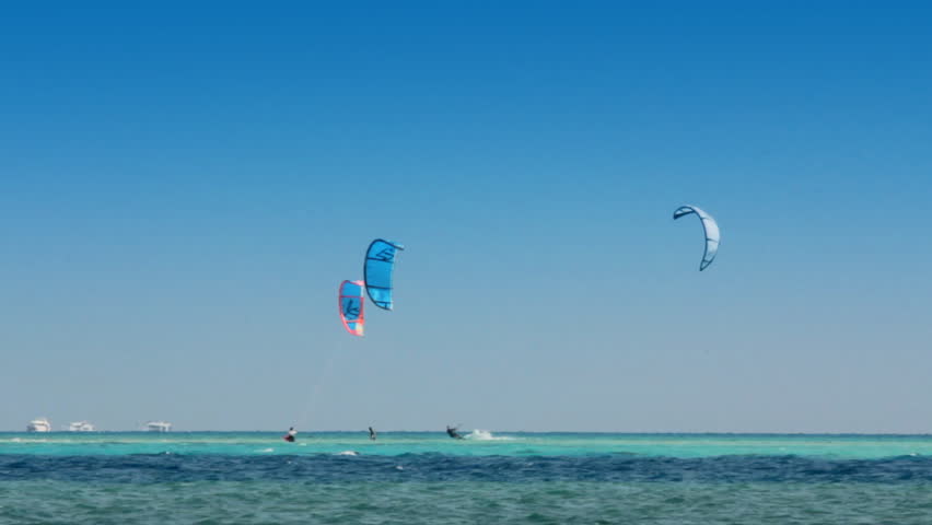 kite surfing - surfers on blue sea surface - timelapse