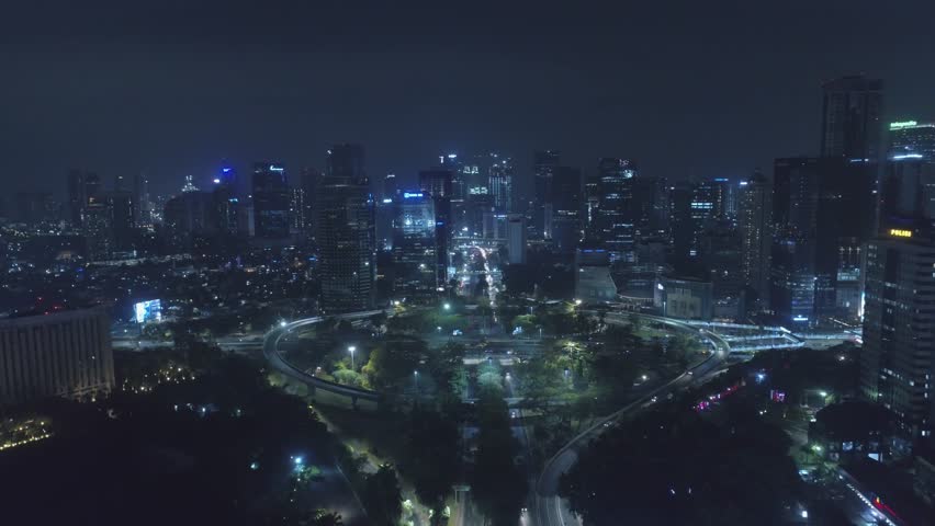 Jakarta, Indonesia - July 09, 2018: Aerial View of Simpang Susun Semanggi with Jakarta Downtown Skyline with High-Rise Buildings at Night, Indonesia, Asia | Shutterstock HD Video #1013794472