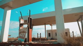Old dirty deserted gas station. U.S. Route 66. lifestyle crisis road 66 fueling slow motion video. closed supermarket store shop Abandoned gas station oil end of fuel the world apocalypse petrol. main