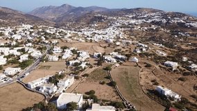 Aerial drone bird's eye view video of picturesque and traditional whitewashed main town or chora of Sifnos island, Cyclades, Greece