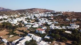Aerial drone bird's eye view video of picturesque and traditional whitewashed village of Artemonas, Sifnos island, Cyclades, Greece