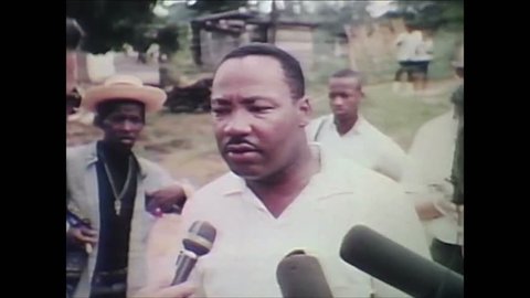 CIRCA 1951 - Martin Luther King Jr. is interviewed and the Ku Klux Klan burns a cross and gambling is shown.