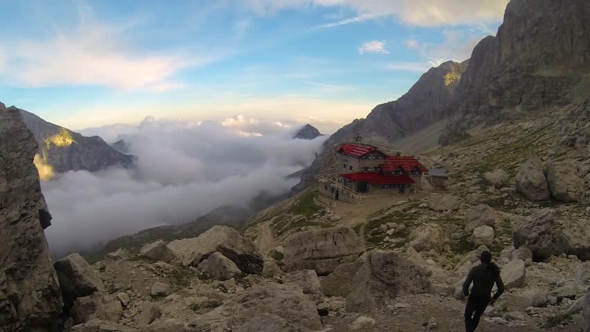 Timelapse with clouds fog sea moving. You can see rifugio Agostini at 2405 meter altitude. The mountaneer refuge is situated in val Ambiez, near cima Tosa, an important summit in the brenta dolomites