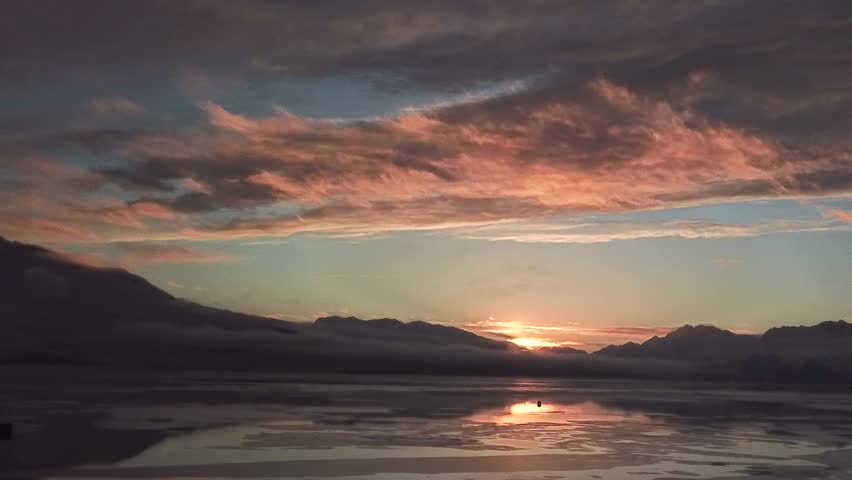 Beautiful sunset shot in a deep Alaskan winter, the water is starting to freeze over. (Valdez)