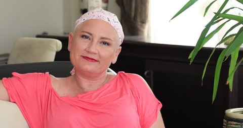 Portrait of a smiling woman with cancer. Breast cancer survivor