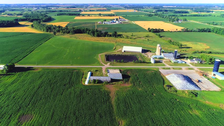 Aerial view of Wisconsin farm fields checkerboarded with healthy crops.
