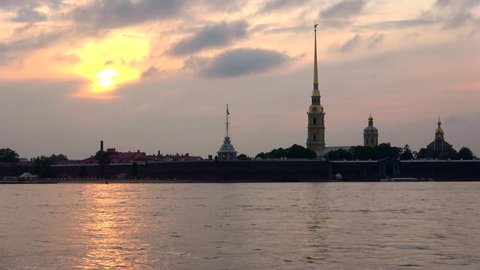 Peter and Paul fortress on the background cloud sunset (timelapse). St. Petersburg, Russia