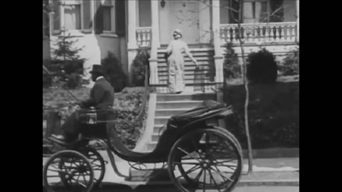 CIRCA 1920s - Two men ride by on a tandem bike, a woman arrives at a home by carriage, and two girls ride bikes and pick flowers in the late 1800s.