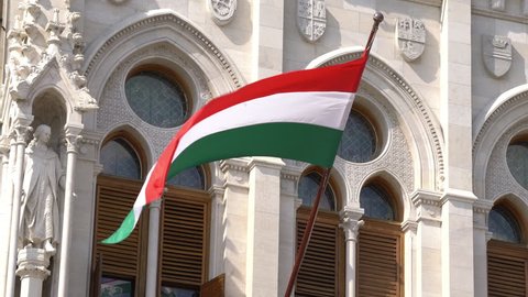 Budapest, Hungary. July 2018. The hungarian flag waving on a palace in Budapest, Hungary	