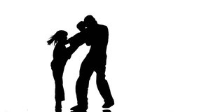 Men with a girl in helmets and boxing gloves beating in the ring . Silhouette. White background - Powered by Shutterstock - Get 15% off with code: PIKWIZARD15