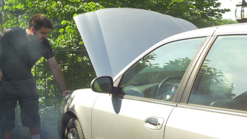 Man with an over heated car