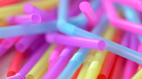 Banning plastic straws enviromental concerns concept, macro dolly shot.
