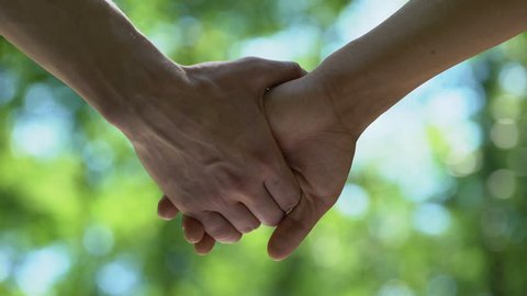 Man letting partners hand go, homosexual couple break up, misunderstanding