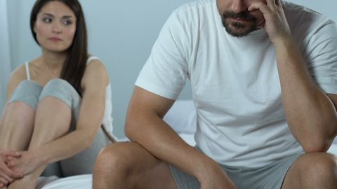 Unhappy husband ignoring caring wife, sexual dysfunction, problems at work