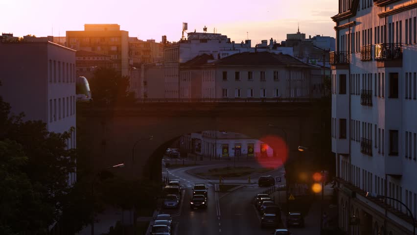 sunset time lapse over street of the city of Warsaw