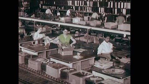 CIRCA 1950s - Reel to reel tapes are duplicated in the 1950s and a record factory is shown.