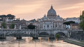 The Sant'Angelo bridge and the St. Peter's Basilica dome in the background. Day to night time lapse video.