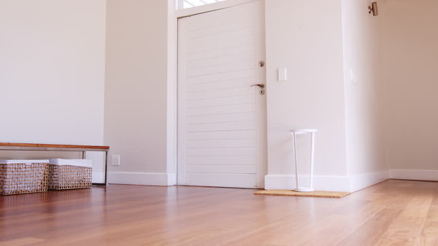 Mother And Children Returning Home After School Day