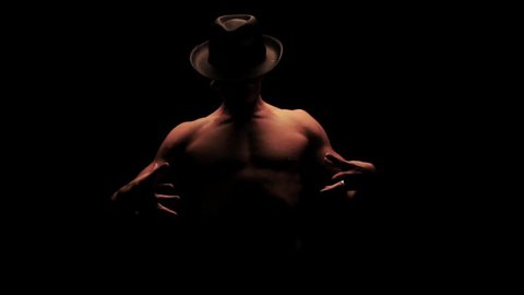 Silhouette of a man dancing in the dark