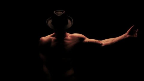 Silhouette of a man dancing in the dark