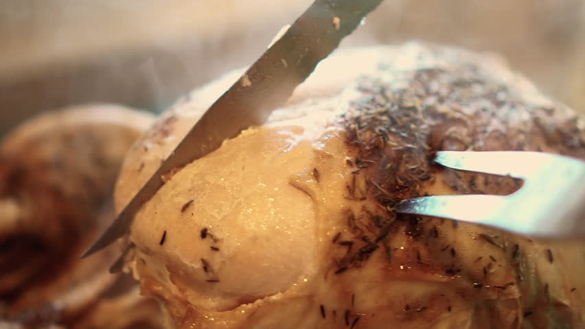 Carving the breast of a turkey close up, in slow motion | Shutterstock HD Video #1013967656