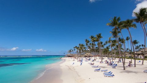 blue sea Bahamas, beach sand, exotic palm trees, white sand, white sand beach / Top view of the beach in the Caribbean turquoise Sea water. Paradise Island, a very beautiful beach with white sand.