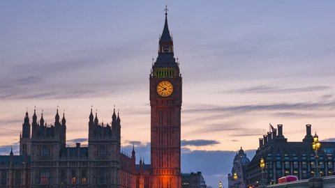 London, England - April 5, 2016: Timelapse with zoom of Elizabeth Tower Big Ben on the Palace of Westminster at sunset