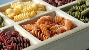 Dried fusilli pasta in wooden white box