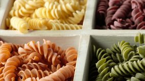 Dried fusilli pasta in wooden white box