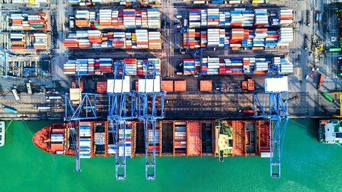4K Timelapse of modern industrial port with containers from top view or aerial view. It is an import and export cargo port where is a part of shipping dock. Singapore
