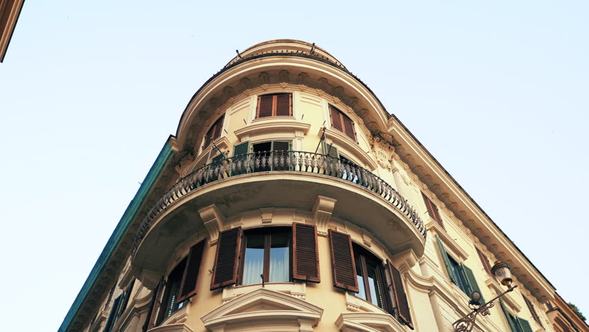 Apartment building streets in Rome. Windows with shutters. Facades of old houses in the streets of Italy. Traveling concept. Slow motion. 4k