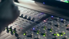 the sound engineer at the concert sound mixing console conducts a sound check of the musical rock band - Powered by Shutterstock - Get 15% off with code: PIKWIZARD15