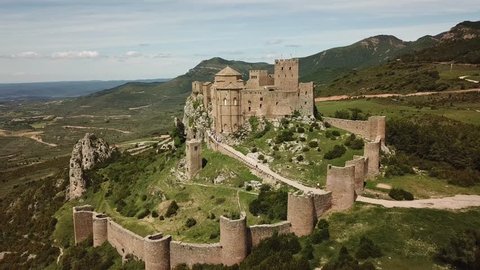 Aerial view of an ancient medieval Castle of Loarre (Castillo de Loarre) in Huesca, Aragon, Spain and a picturesque valley surrounding it