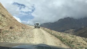 car driving in the mountains in the daytime