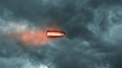 Bullet flying on background of dark cloud sky.
Slow Motion of bullet on foreground.
