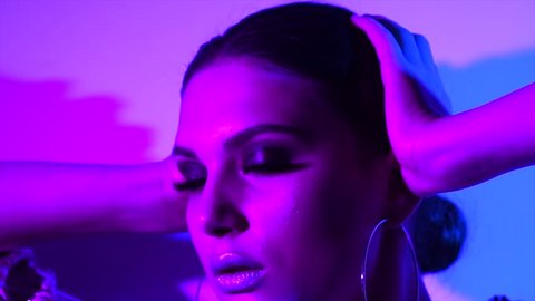 Fashion model girl in neon light, beautiful model woman with make-up, Art design of female disco dancing, posing in UV, colorful make up. Night club, Party. 4K UHD slow motion video footage स्टॉक वीडियो