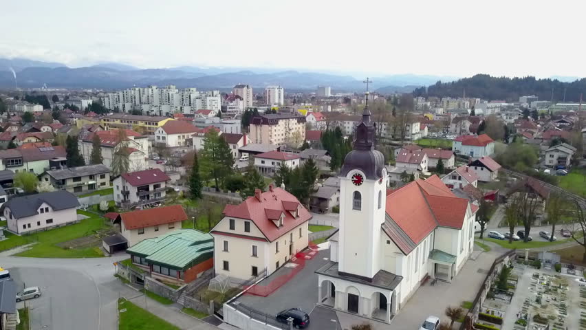 A middle-size town and there is a church in front of the video.