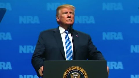 2018 - U.S. President Donald Trump speaks to the NRA and reacts with pride as they chant USA USA USA.