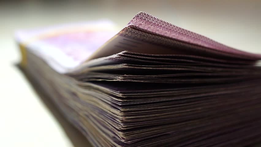 Stack of ringgit banknotes money on table | Shutterstock HD Video #1014060239