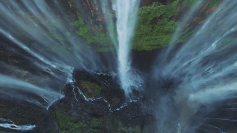 Tumpak sewu rainbow waterfalls aerial scenic view in super slow motion, Indonesia