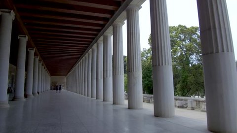 Tracking shot camera moves slowly forward in the interior length of Stoa of Attalos in Athens