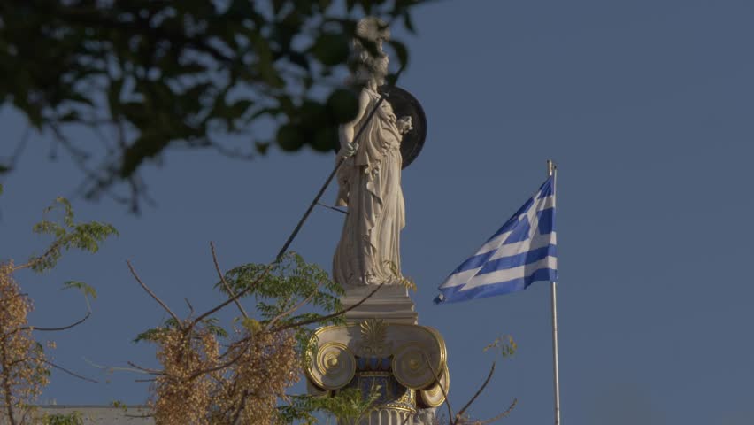 Slider shot of statue in front of Deanery University of Athens, Athens, Greece, Europe