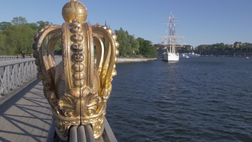 A gilded Swedish crown on the Skeppsholm Bridge (Skeppsholmsbron) in Stockholm, Sweden, Scandinavia, Europe